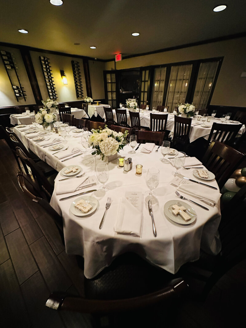 Round table in party room with set long table and set round table