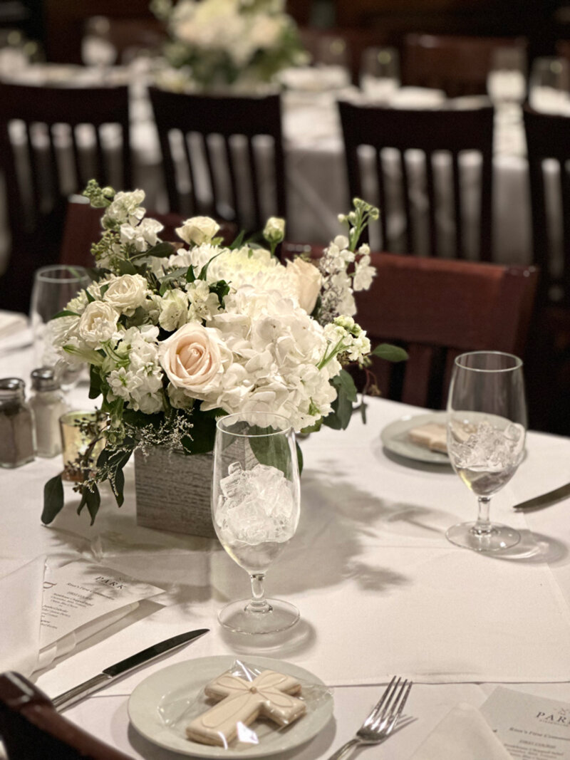 Close up view of party room table with flowers and set plates