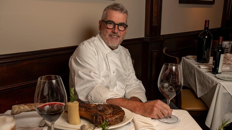 Restaurant chef sitting at table